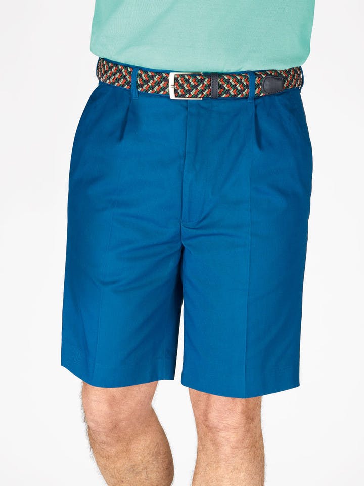 Model wears Men's Royal Blue Cotton Pleated Chino Shorts